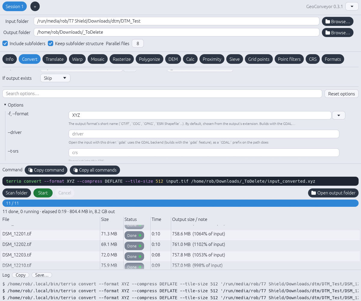 GeoConveyor main window on the Convert tab, showing input and output folders, terrio options, a generated command line and per-file progress